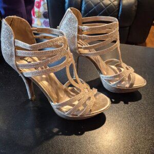 AI Overviewgliþery night out These are glittery gold strappy heels from the bran